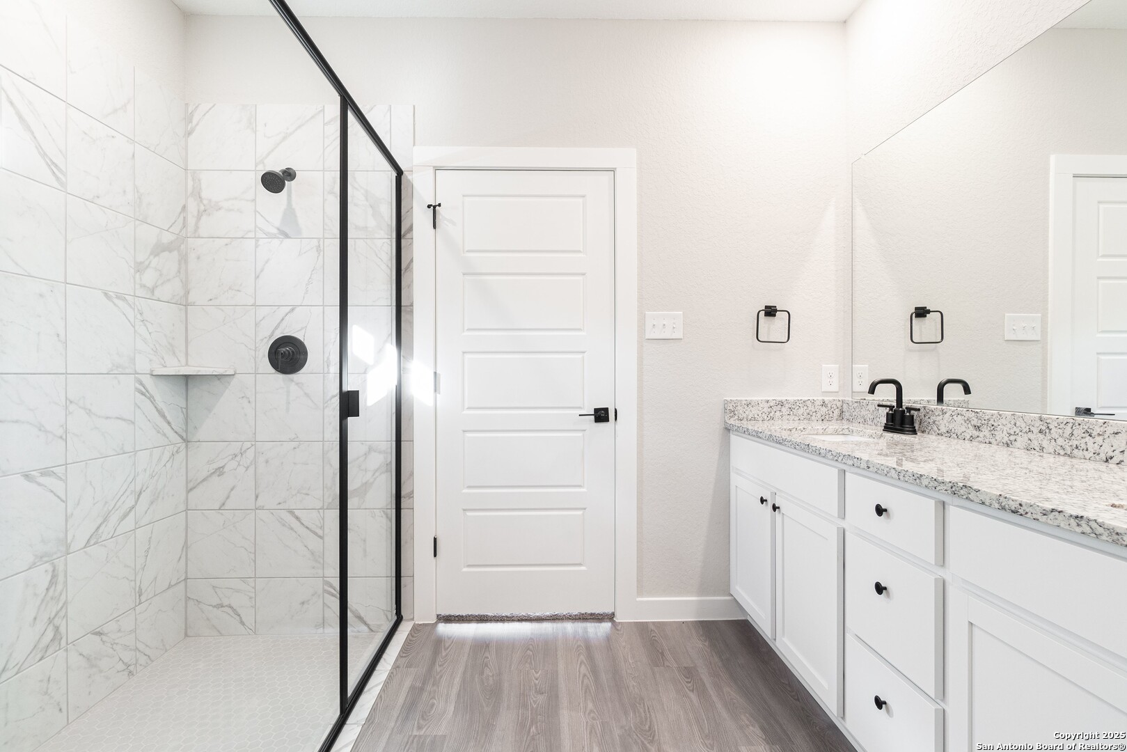 5815 Tree View Street San Antonio, TX 78220 - Photo 13 of 29 a bathroom with a granite countertop shower sink and mirror