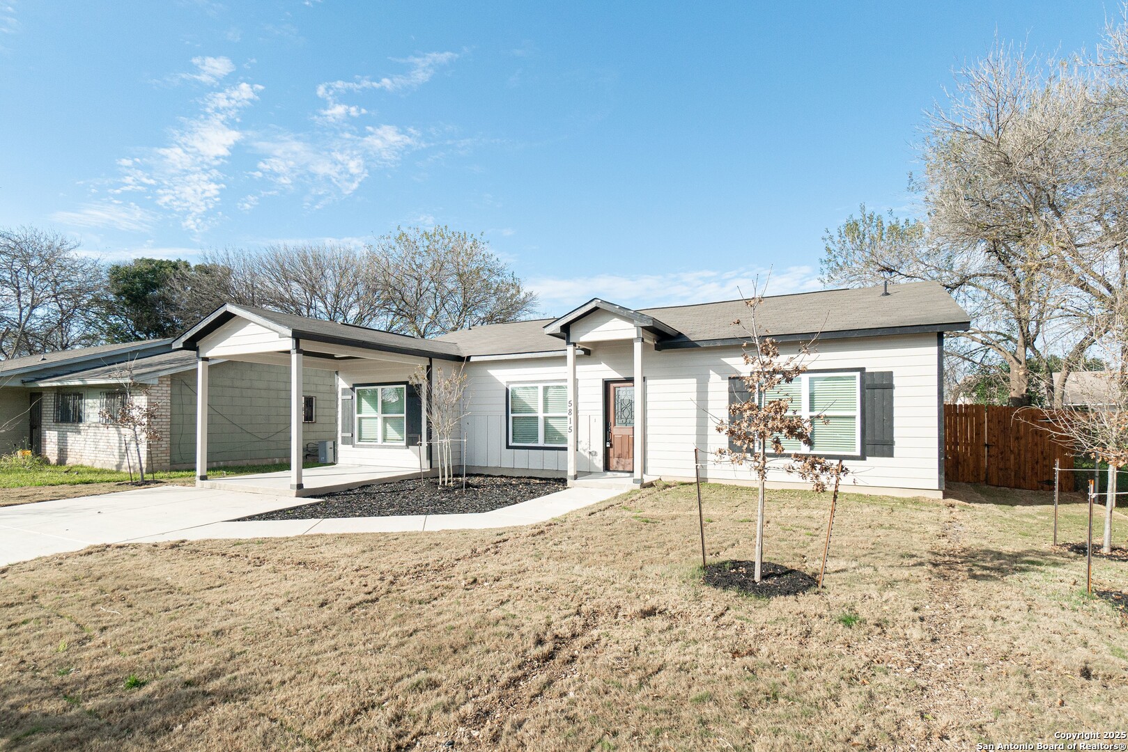 5815 Tree View Street San Antonio, TX 78220 - Photo 2 of 29 a front view of a house with a yard and chandelier