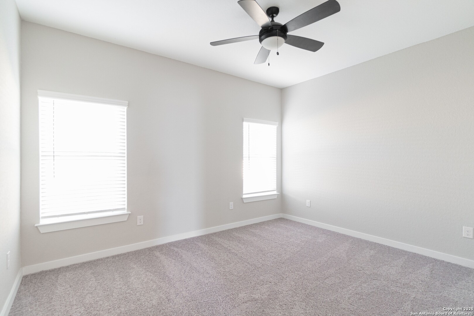 5815 Tree View Street San Antonio, TX 78220 - Photo 21 of 29 an empty room with a window and a fan