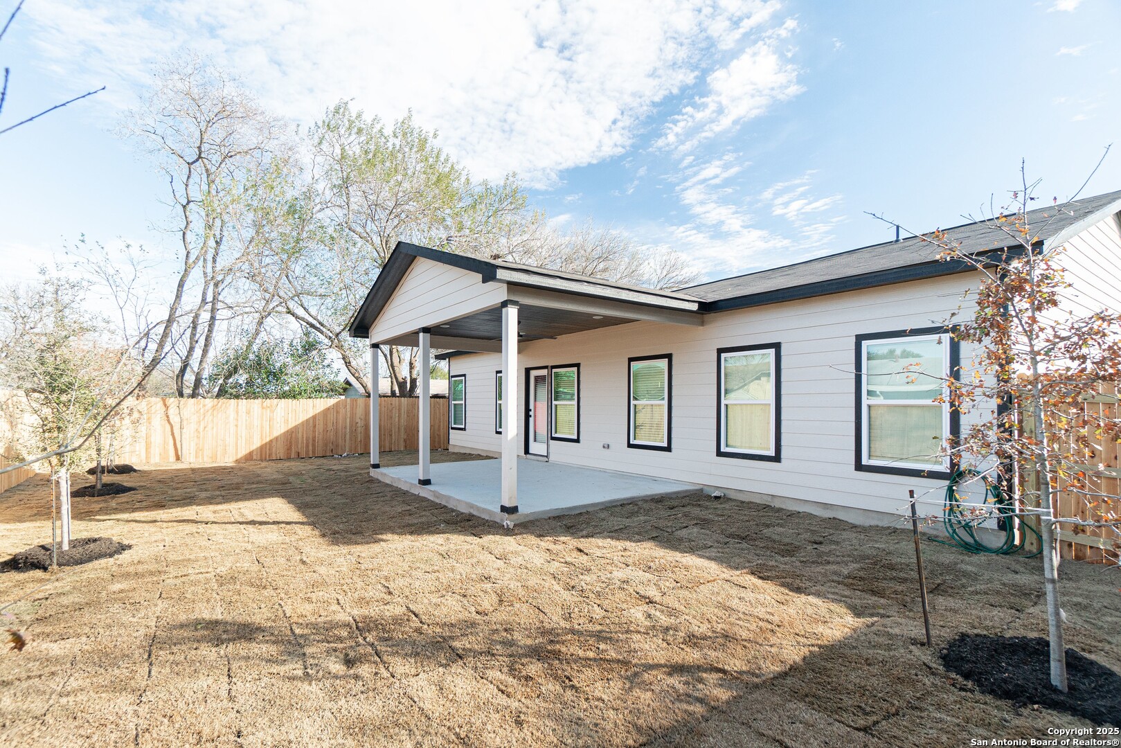 5815 Tree View Street San Antonio, TX 78220 - Photo 24 of 29 a front view of a house with a yard and garage