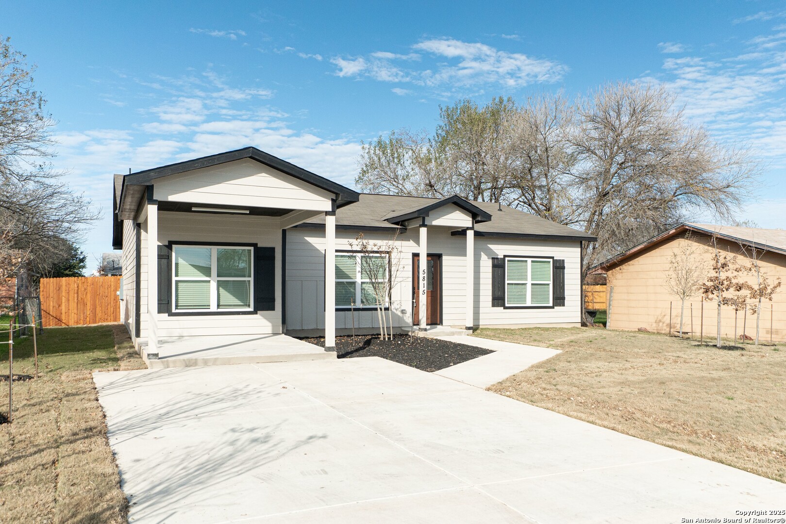 5815 Tree View Street San Antonio, TX 78220 - Photo 3 of 29 a front view of a house with a yard and garage