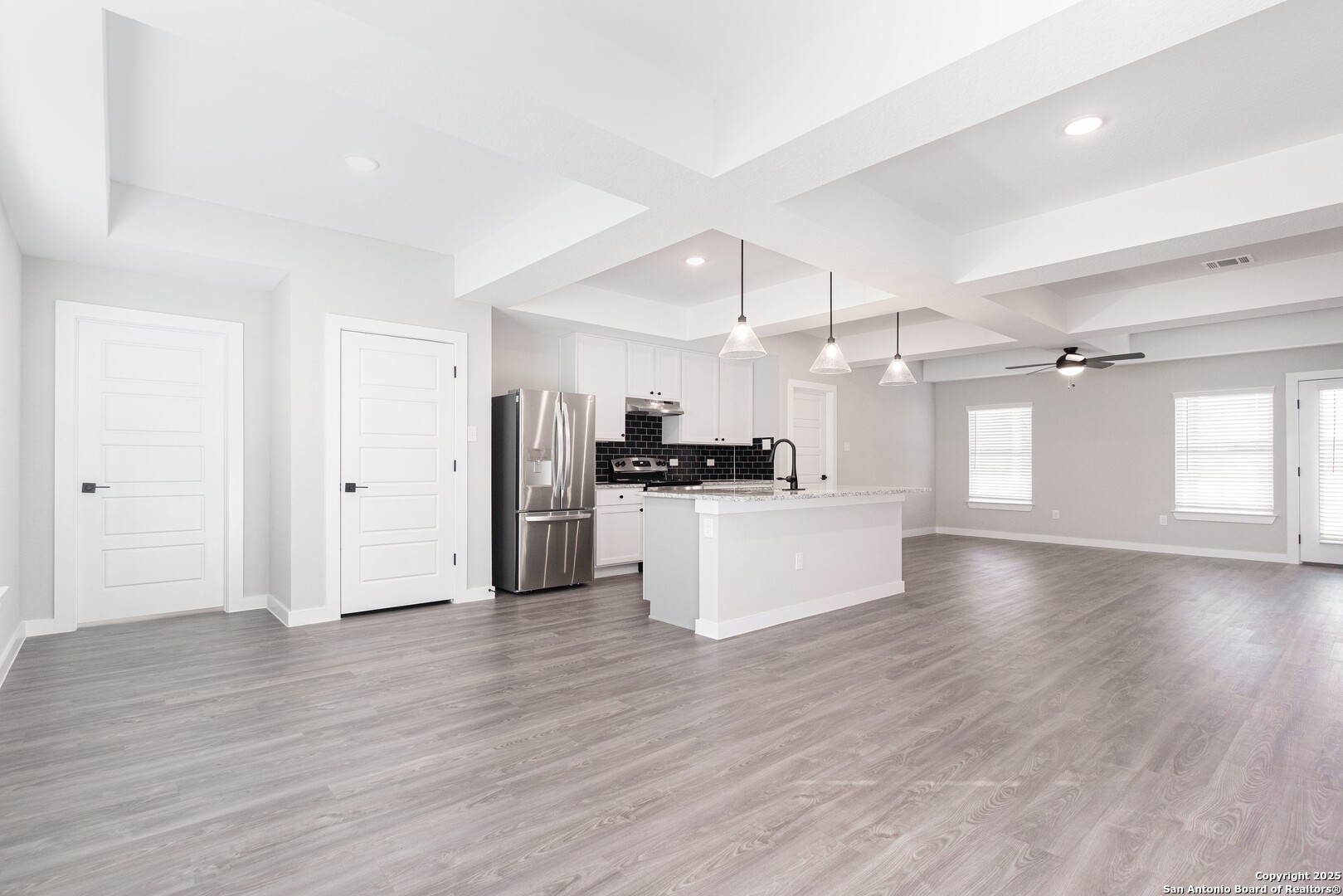5815 Tree View Street San Antonio, TX 78220 - Photo 4 of 29 a view of kitchen with refrigerator stove and wooden floor