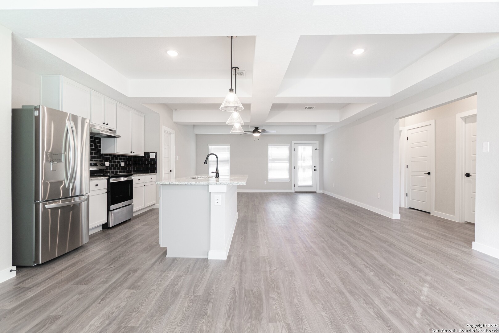5815 Tree View Street San Antonio, TX 78220 - Photo 5 of 29 a view of kitchen with refrigerator microwave and stove top oven