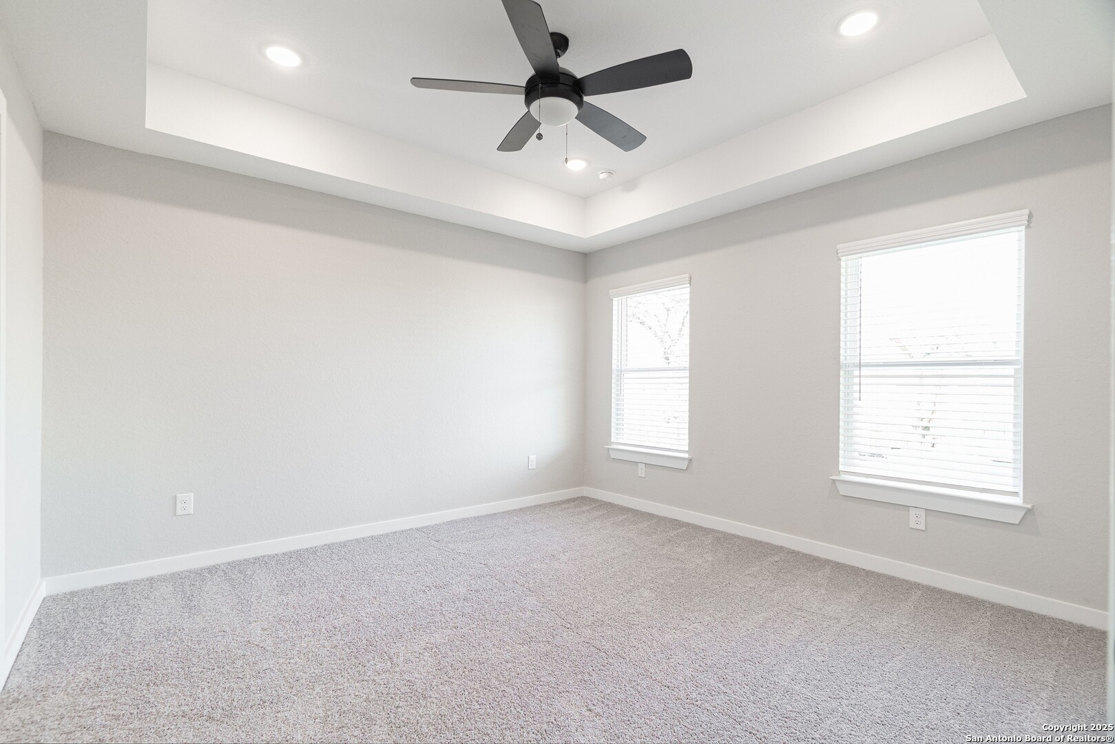 5815 Tree View Street San Antonio, TX 78220 - Photo 10 of 29 an empty room with a window and a fan