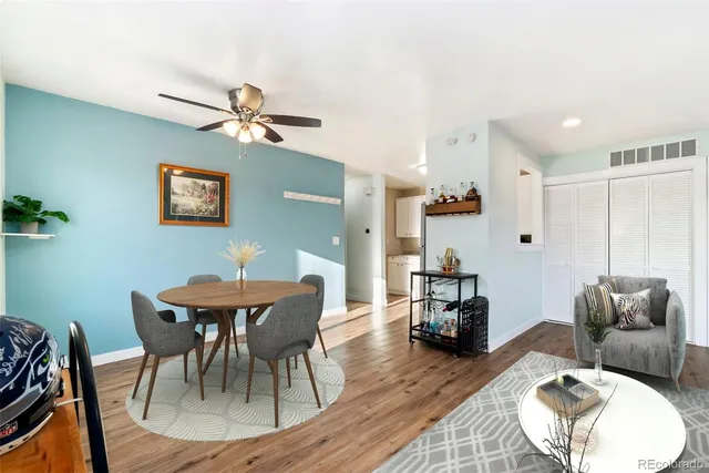 a view of a dining room with furniture and wooden floor