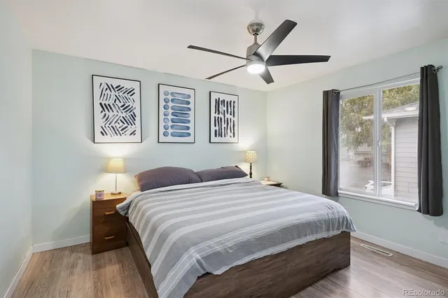 a bedroom with a large bed and a window