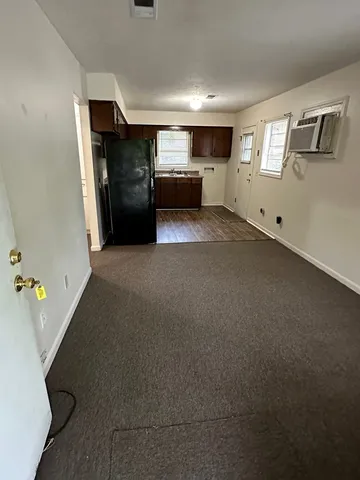 a view of livingroom with furniture and windows