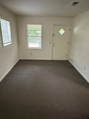 an empty room with windows