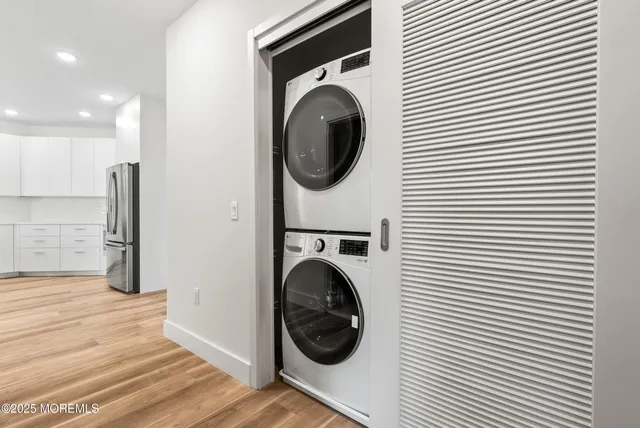 a view of a hallway with washer and dryer