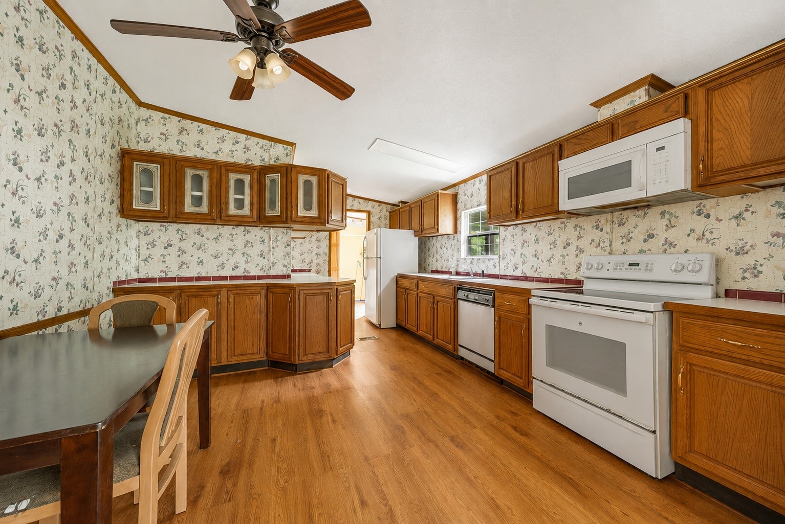 25979 Shade Tree Lane Splendora, TX 77372 - Photo 13 of 22 The heart of the home features a spacious kitchen with extensive cabinetry, generous counter space, and an adjoining dining area, offering endless potential to design a space that reflects your personal style.