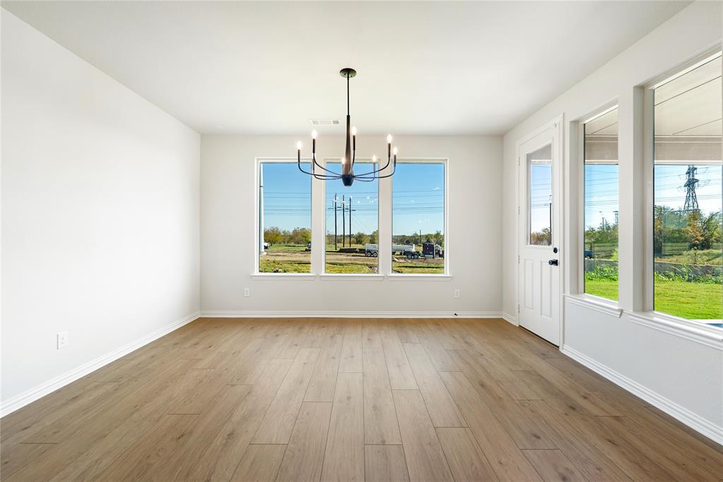 30 Roosevelt Ln Valley View Valley View, TX 76272 - Photo 22 of 35 a view of an empty room with wooden floor and a window