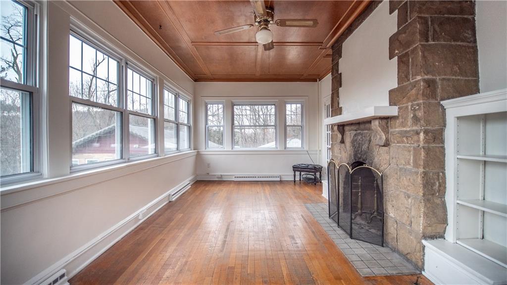 343 East 11th Avenue Tarentum, PA 15084 - Photo 14 of 41 a view of empty room with wooden floor and fan