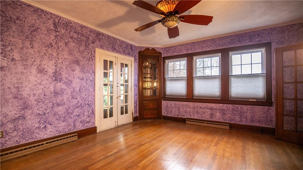 343 East 11th Avenue Tarentum, PA 15084 - Photo 18 of 41 a spacious bedroom with a large bed and a large window with wooden floor