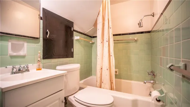 a bedroom with a bed and a fireplace