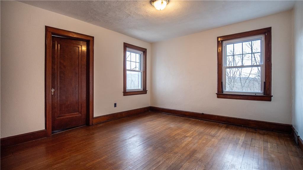 343 East 11th Avenue Tarentum, PA 15084 - Photo 33 of 41 an empty room with wooden floor and windows
