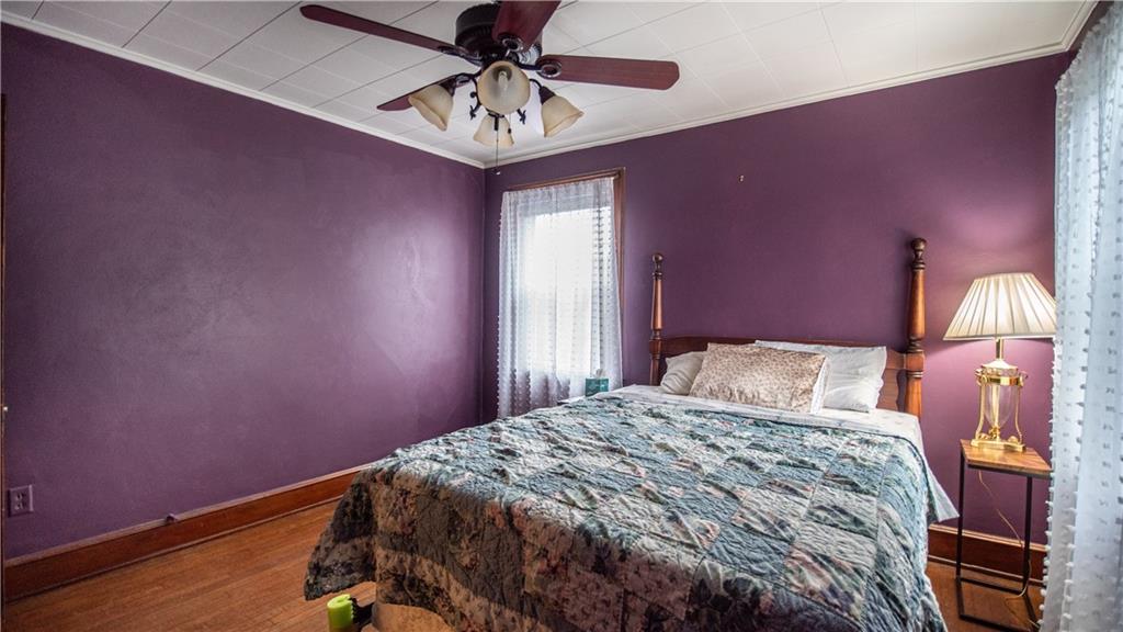 343 East 11th Avenue Tarentum, PA 15084 - Photo 36 of 41 a bedroom with a bed and a chandelier