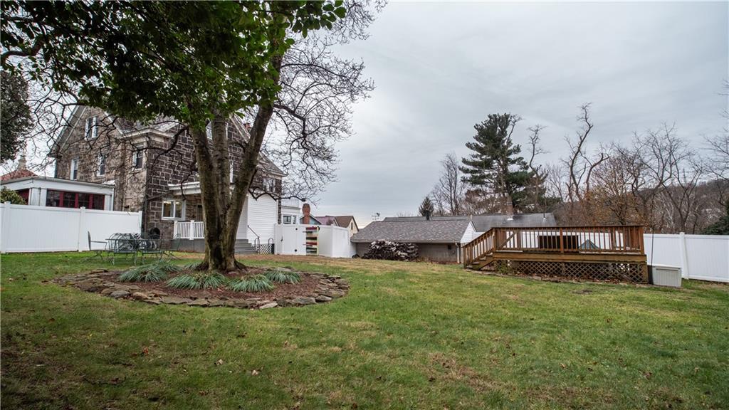 343 East 11th Avenue Tarentum, PA 15084 - Photo 6 of 41 a view of a backyard with a garden and entertaining space