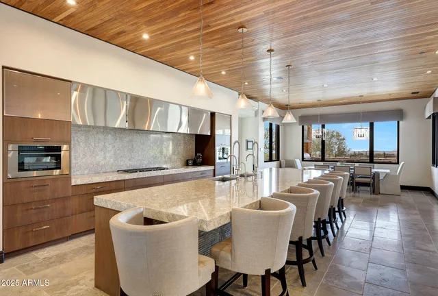 a living room with lots of furniture and a chandelier