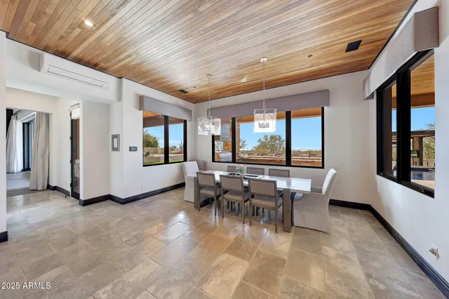 a bedroom with a large bed and a flat screen tv