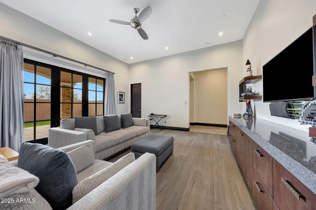 a view of a house with swimming pool and sitting area