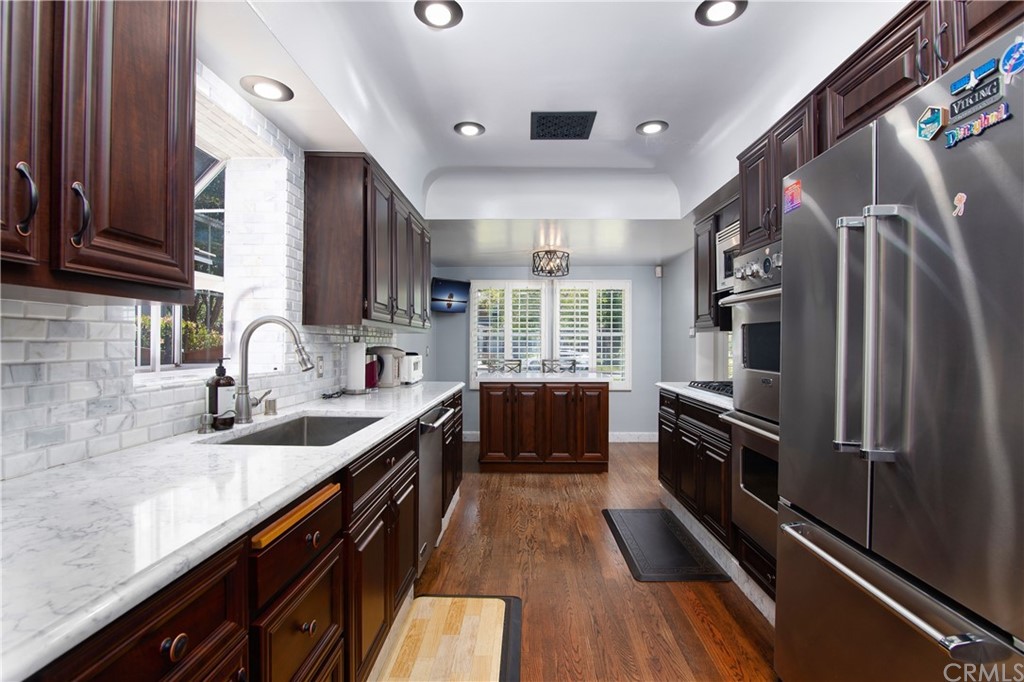 431 Monte Vista Road Arcadia, CA 91007 - Photo 11 of 30 a kitchen with granite countertop a refrigerator a sink dishwasher stove and oven