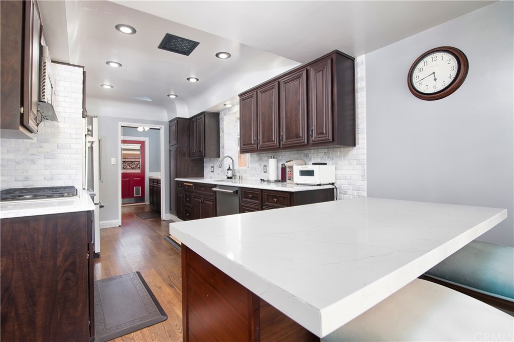 431 Monte Vista Road Arcadia, CA 91007 - Photo 12 of 30 a kitchen with stainless steel appliances kitchen island a refrigerator sink and cabinets