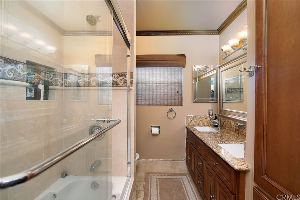 431 Monte Vista Road Arcadia, CA 91007 - Photo 21 of 30 a bathroom with a granite countertop sink a mirror and a shower