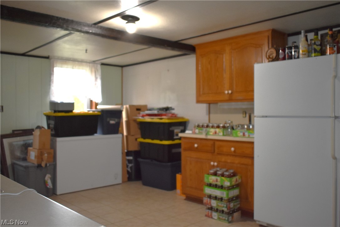 1597 South Funk Road Wooster, OH 44691 - Photo 27 of 35 Basement w/ additional kitchen. Tiled flooring
