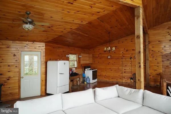 a living room with fireplace furniture and a flat screen tv