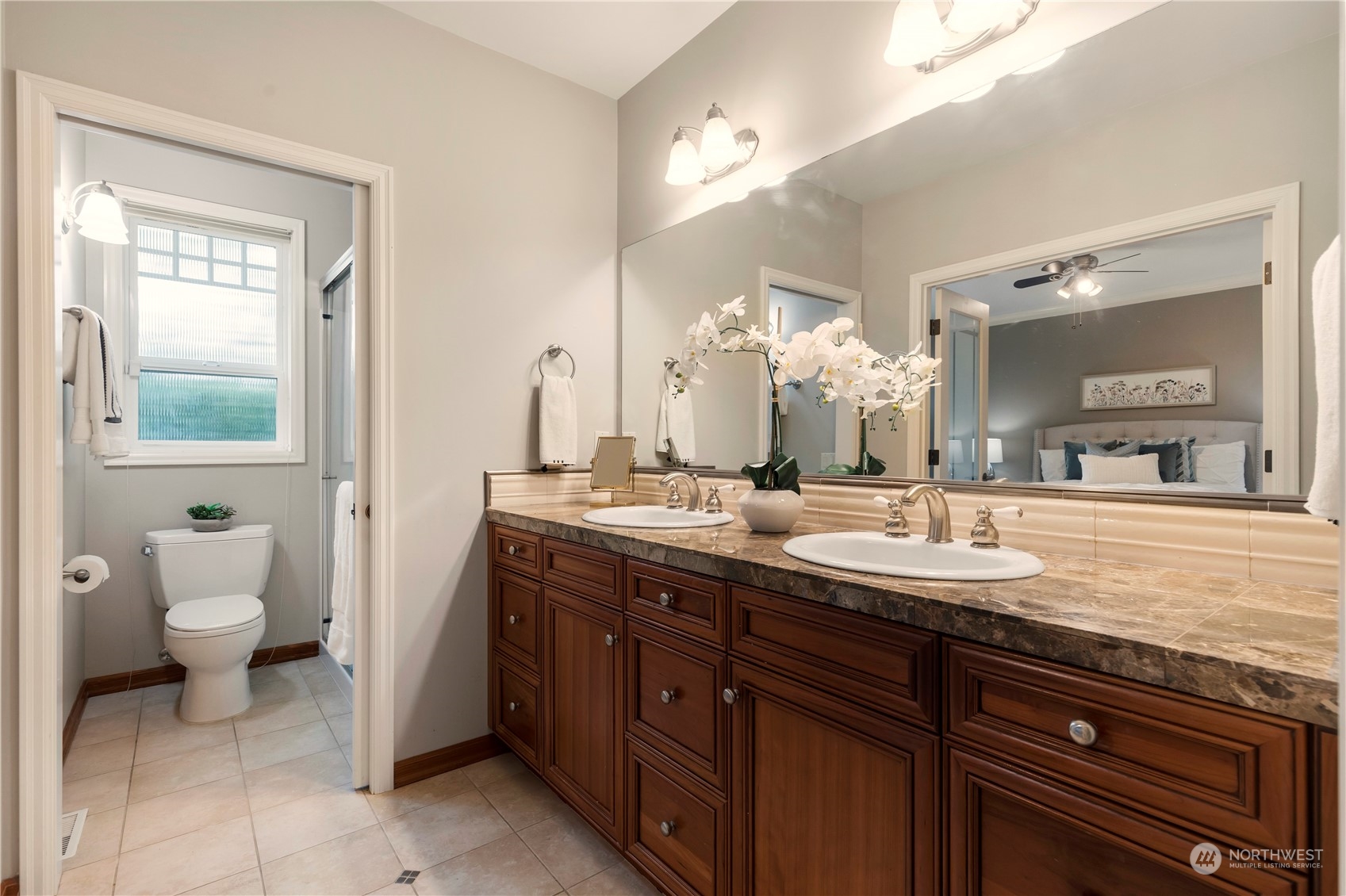 8507 Bowdoin Way, Unit 2 Edmonds, WA 98026 - Photo 16 of 24 a bathroom with a granite countertop sink and a mirror