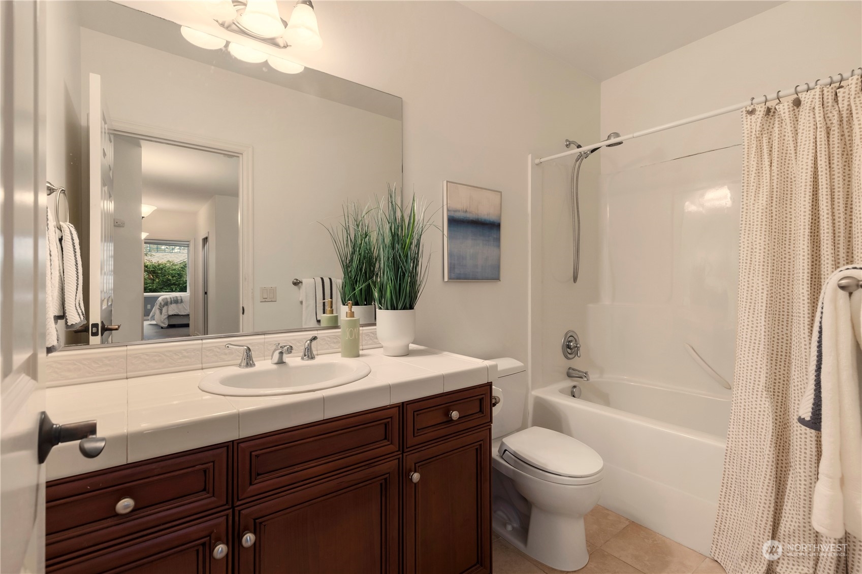 8507 Bowdoin Way, Unit 2 Edmonds, WA 98026 - Photo 20 of 24 a bathroom with a sink a toilet and shower
