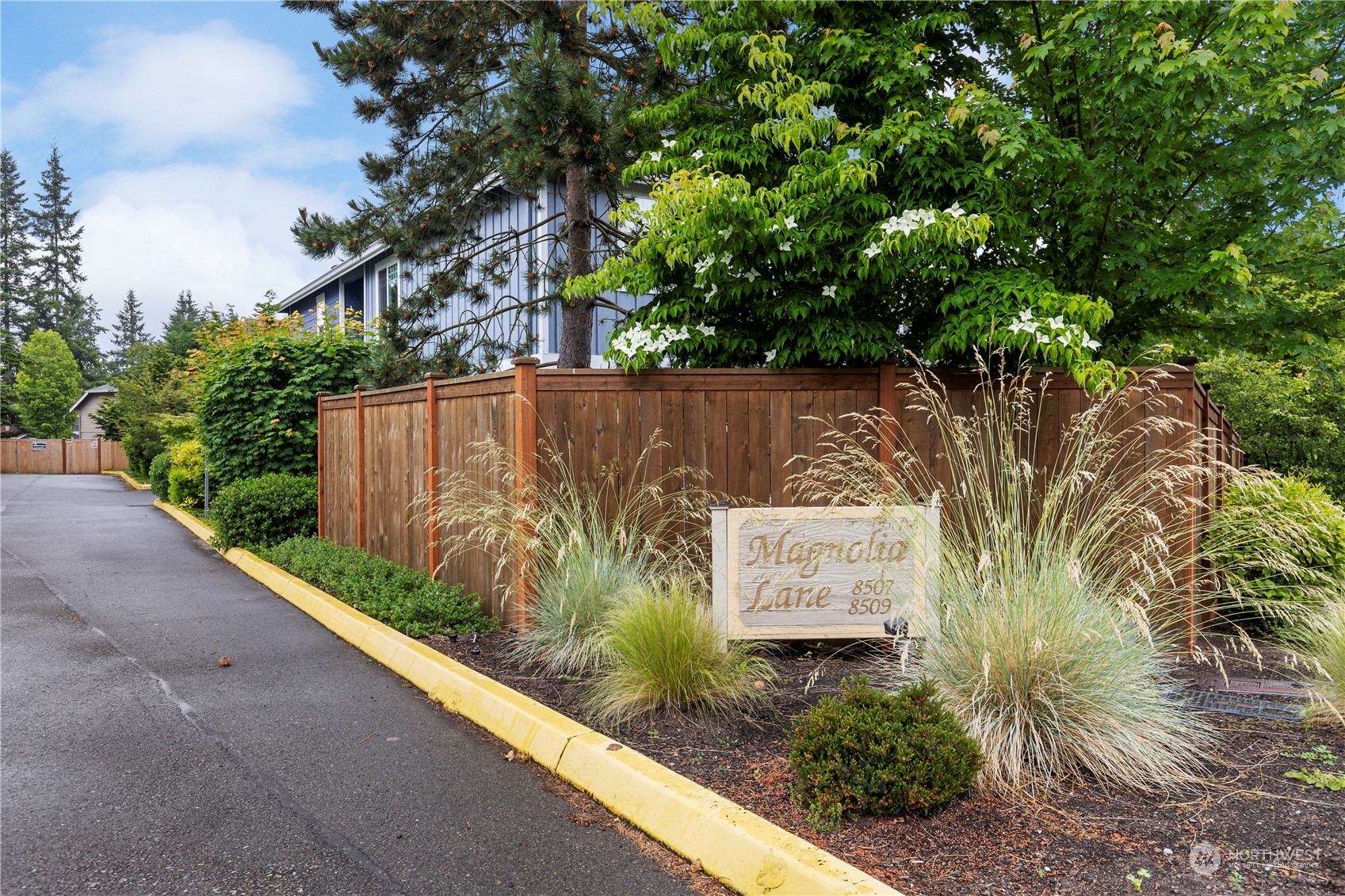 8507 Bowdoin Way, Unit 2 Edmonds, WA 98026 - Photo 2 of 24 a view of a sign in a garden