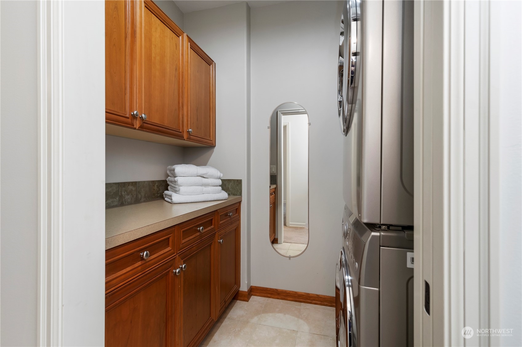 8507 Bowdoin Way, Unit 2 Edmonds, WA 98026 - Photo 21 of 24 a bathroom with a granite countertop sink and a mirror