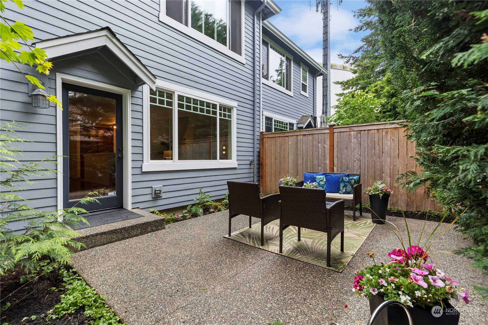 8507 Bowdoin Way, Unit 2 Edmonds, WA 98026 - Photo 23 of 24 a view of a house with a backyard and sitting area
