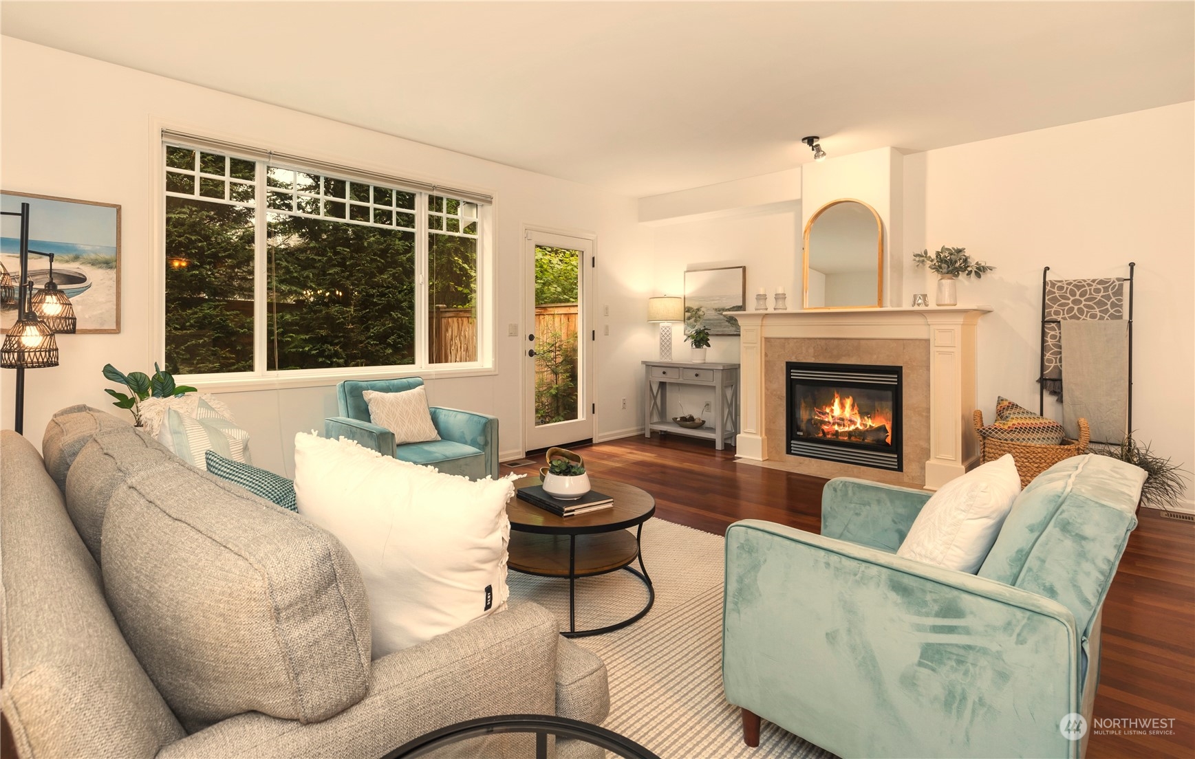 8507 Bowdoin Way, Unit 2 Edmonds, WA 98026 - Photo 7 of 24 a living room with furniture a fireplace and a large window