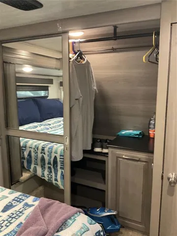 a utility room with closet and a fireplace