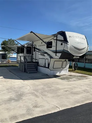 swimming pool view with a seating space