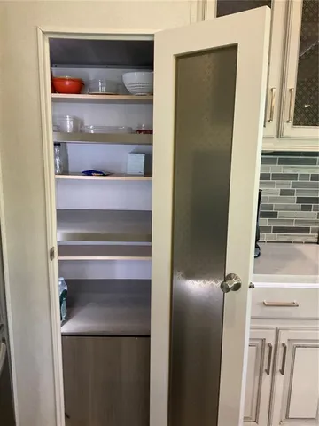 a view of an empty walk in closet