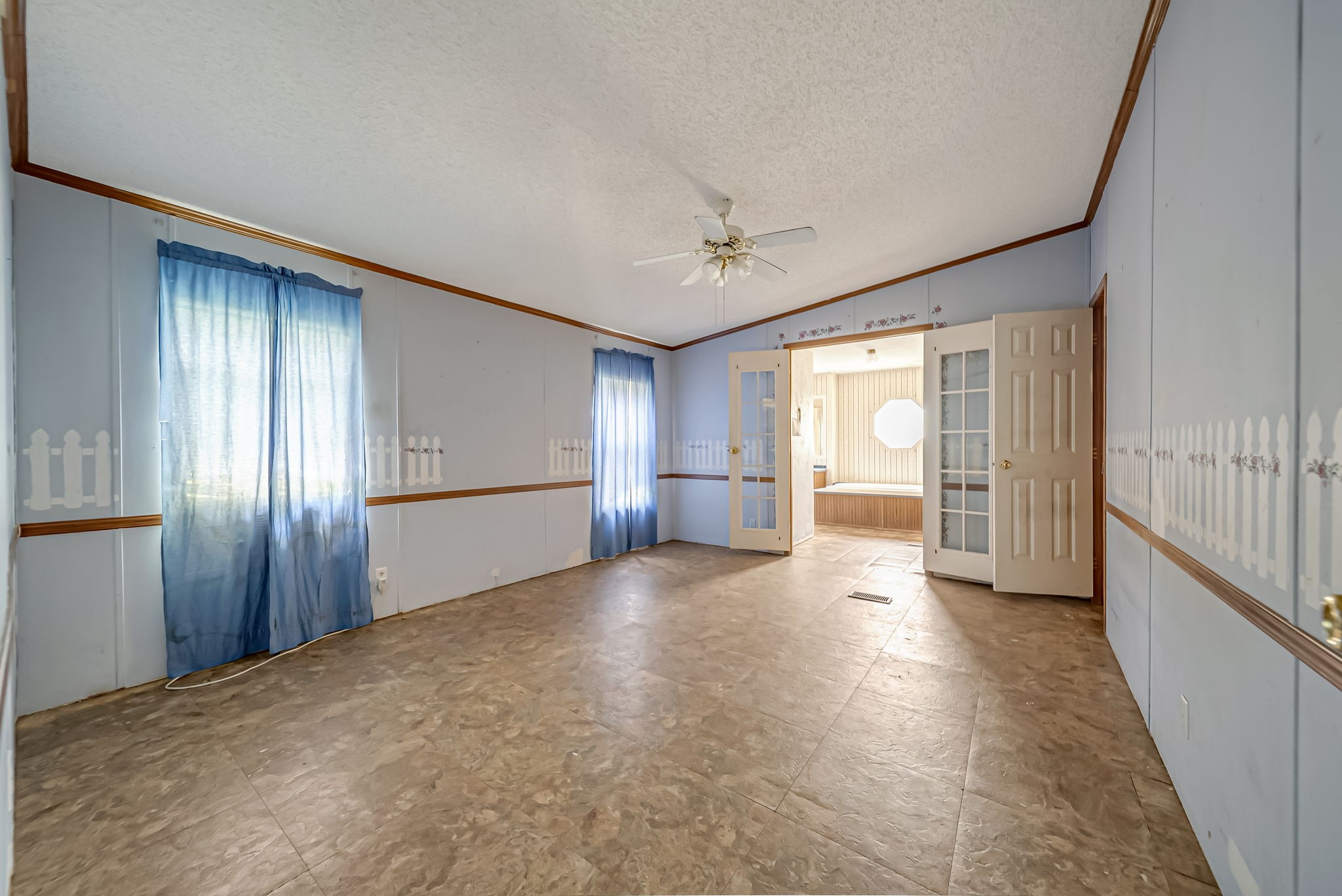 25979 Shade Tree Lane Splendora, TX 77372 - Photo 15 of 22 The expansive primary suite provides a comfortable retreat with ample space for a sitting area or additional furnishings, while the private en-suite bathroom adds everyday convenience.