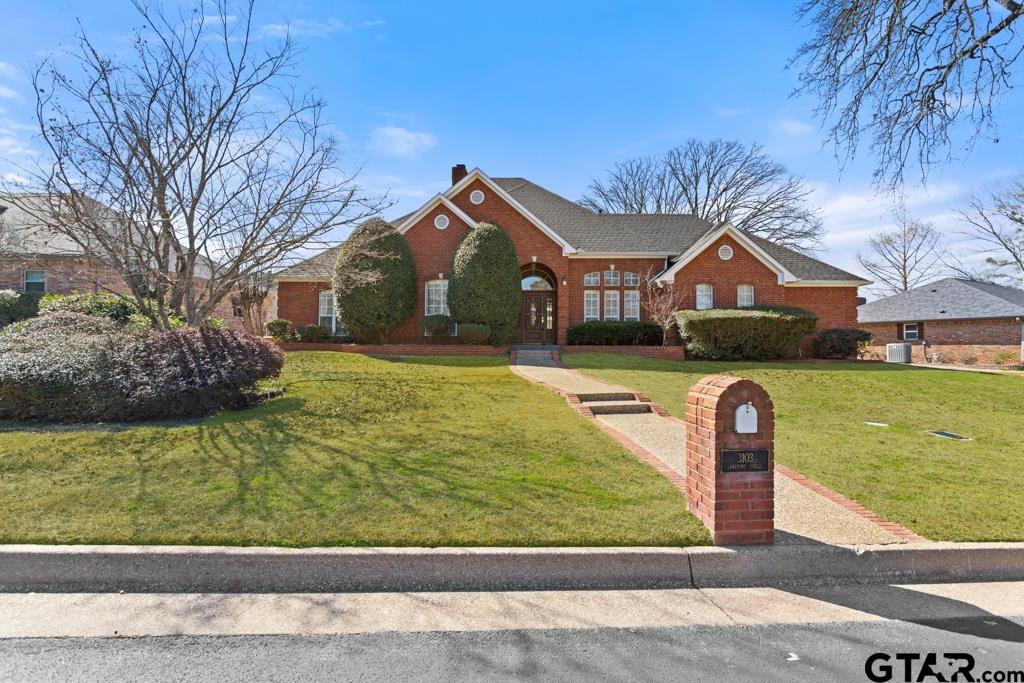 3103 Lakepine Circle Tyler, TX 75707 - Photo 1 of 48 a front view of a house with a yard