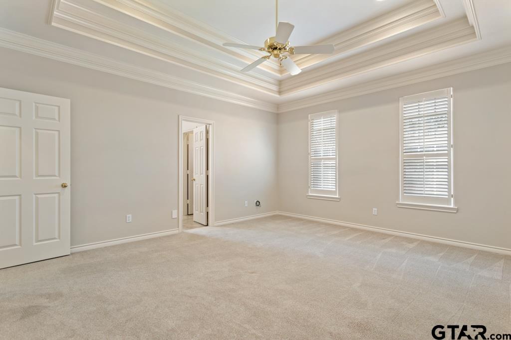 3103 Lakepine Circle Tyler, TX 75707 - Photo 23 of 48 an empty room with windows and fan