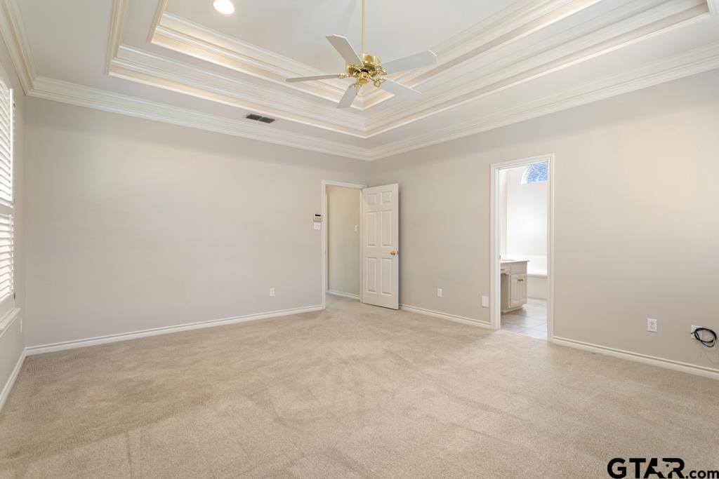 3103 Lakepine Circle Tyler, TX 75707 - Photo 24 of 48 an empty room with a ceiling fan and a window