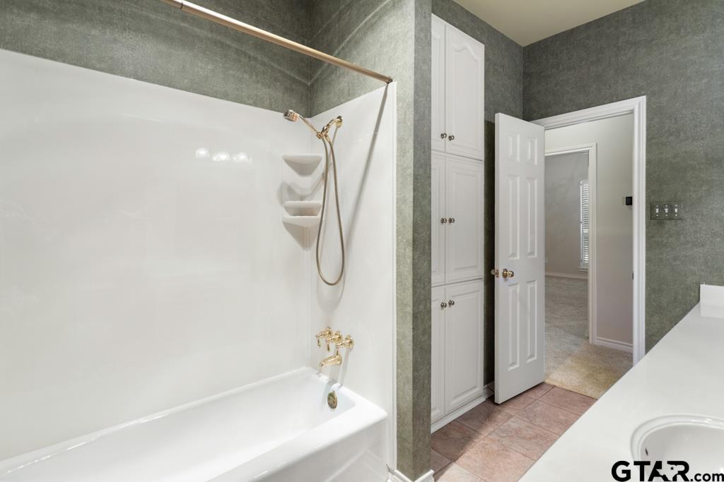 3103 Lakepine Circle Tyler, TX 75707 - Photo 37 of 48 a bathroom with a bathtub and a shower