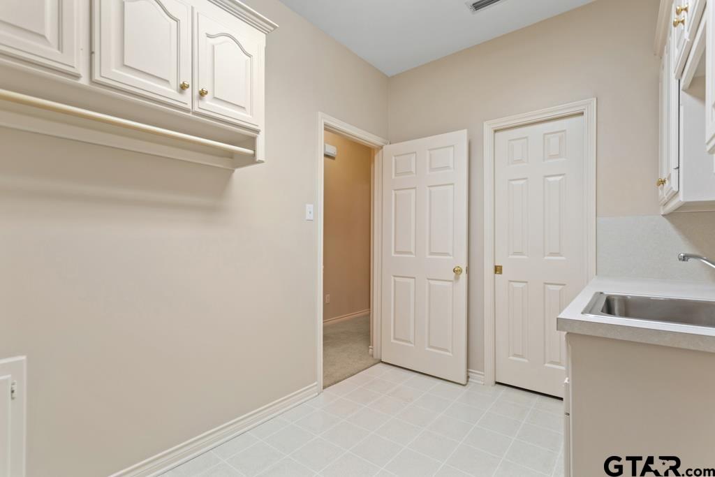 3103 Lakepine Circle Tyler, TX 75707 - Photo 39 of 48 a view of kitchen and utility room