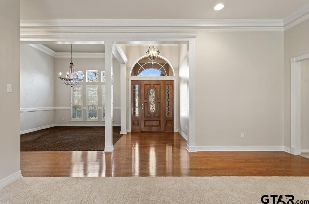 3103 Lakepine Circle Tyler, TX 75707 - Photo 4 of 48 a view of a hallway with wooden floor and a livingroom view