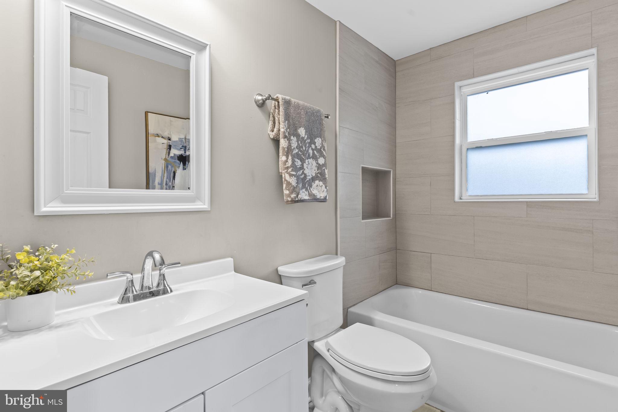 38461 Chaptico Road Mechanicsville, MD 20659 - Photo 16 of 35 a bathroom with a sink toilet and shower