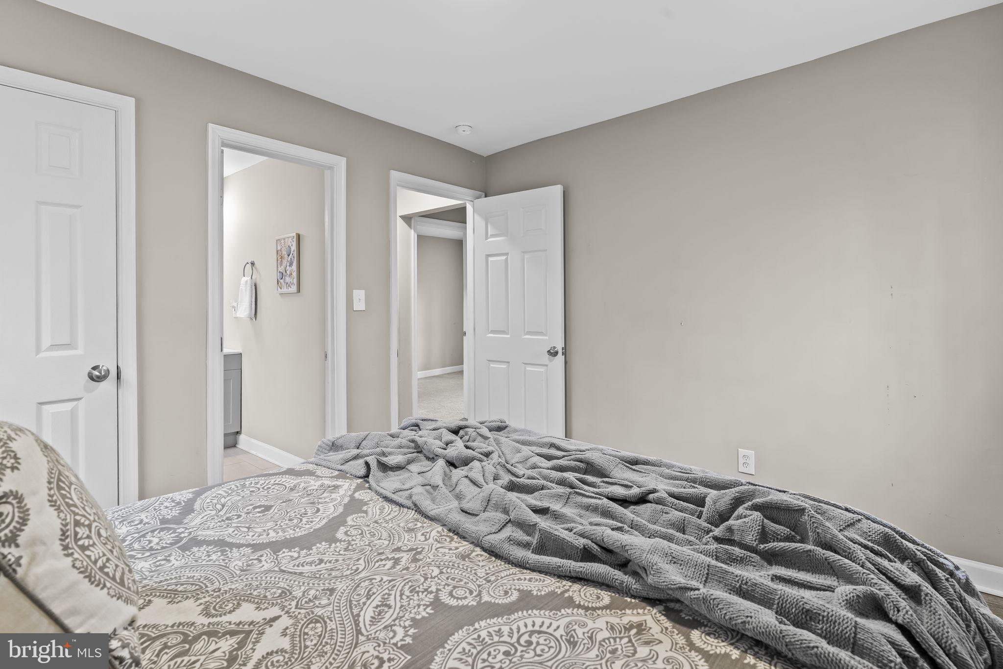 38461 Chaptico Road Mechanicsville, MD 20659 - Photo 17 of 35 a bedroom with a bed and a mirror