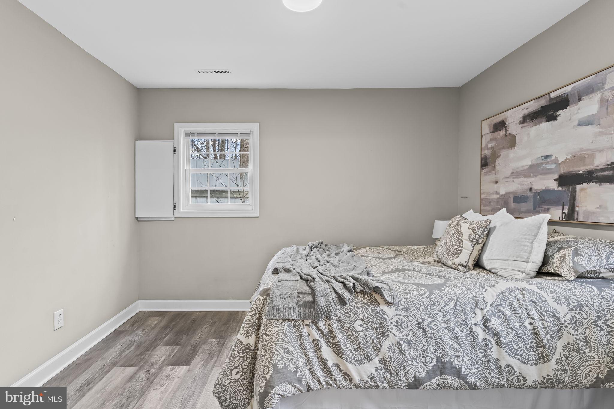 38461 Chaptico Road Mechanicsville, MD 20659 - Photo 20 of 35 a bedroom with a bed and a window