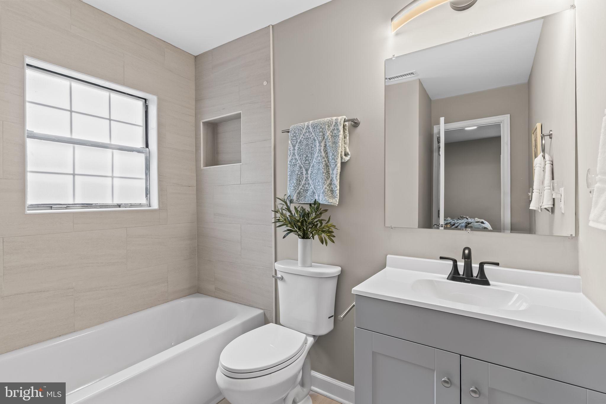 38461 Chaptico Road Mechanicsville, MD 20659 - Photo 21 of 35 a bathroom with a sink a toilet and shower