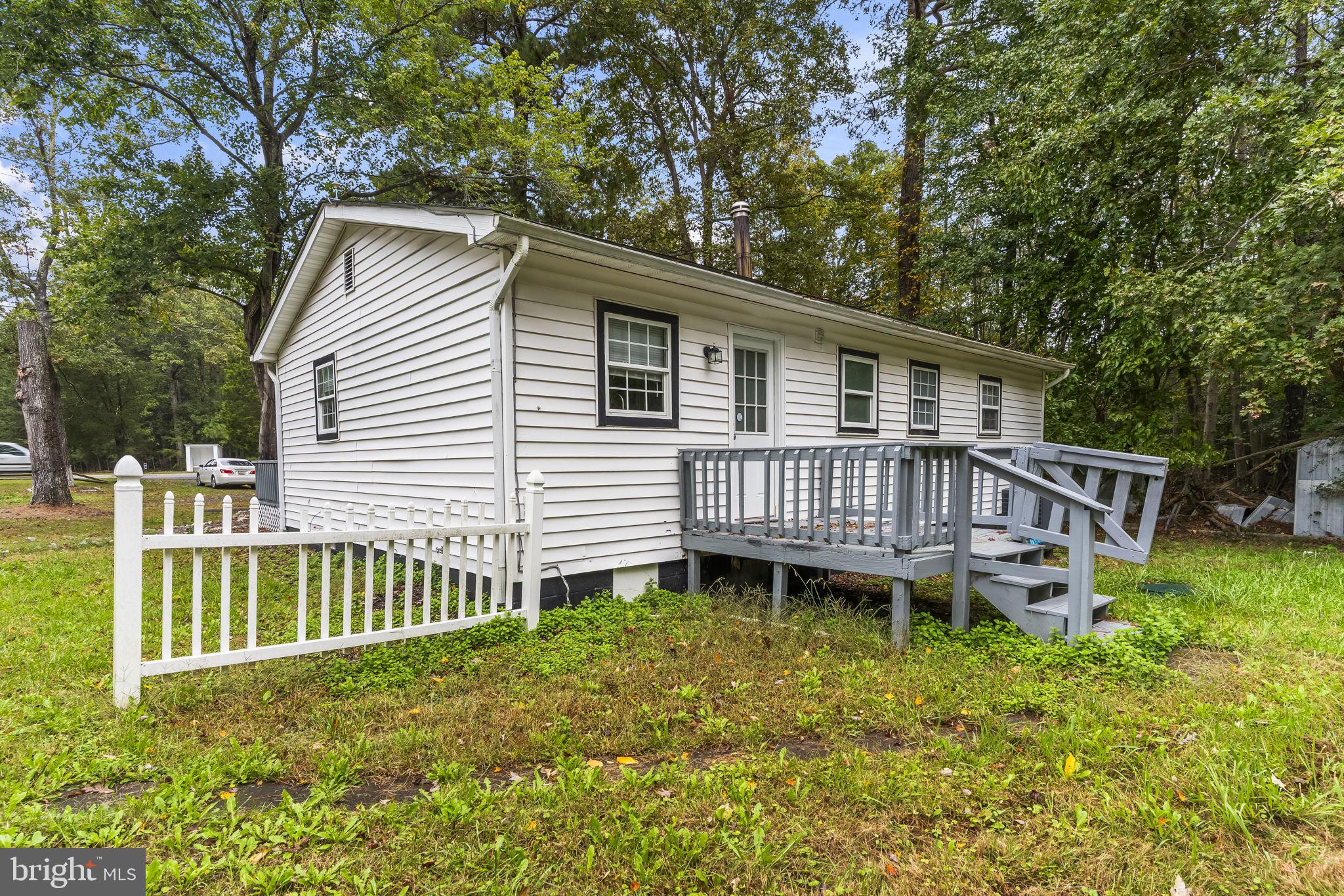 38461 Chaptico Road Mechanicsville, MD 20659 - Photo 29 of 35 a view of a house with a yard and deck